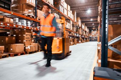 Warehouse worker transporting goods